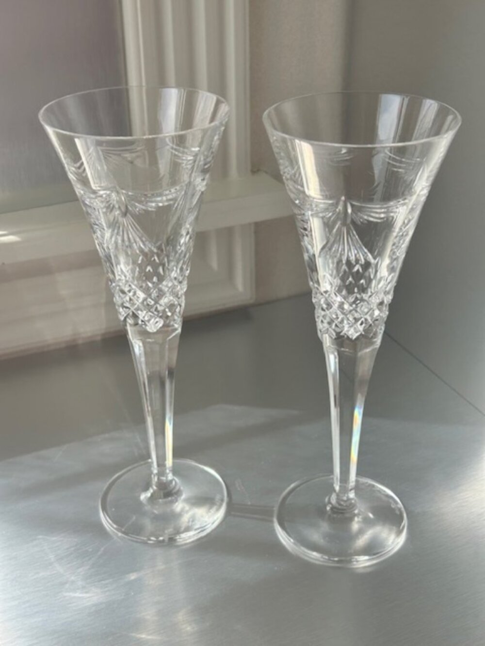 Two (2) Waterford Crystal Champagne "Peace" flutes, 2000